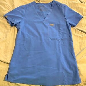 Figs ceil blue scrub top, size xxs with one pocket.